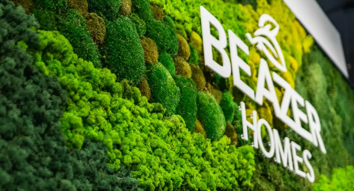 Detailed view of various shades and textures of preserved reindeer and bun moss used in a custom living wall.