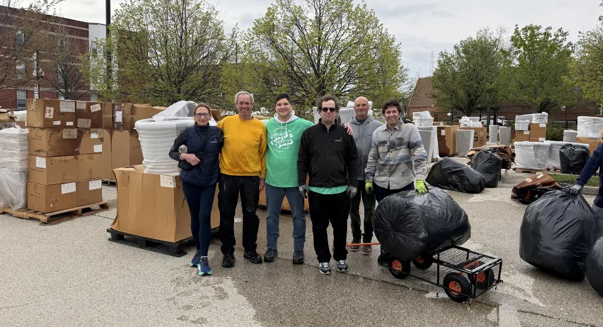 The Ambius team poses for a picture at the start of an incredibly smooth container donation distribution at Marshall High School in Chicago, IL.