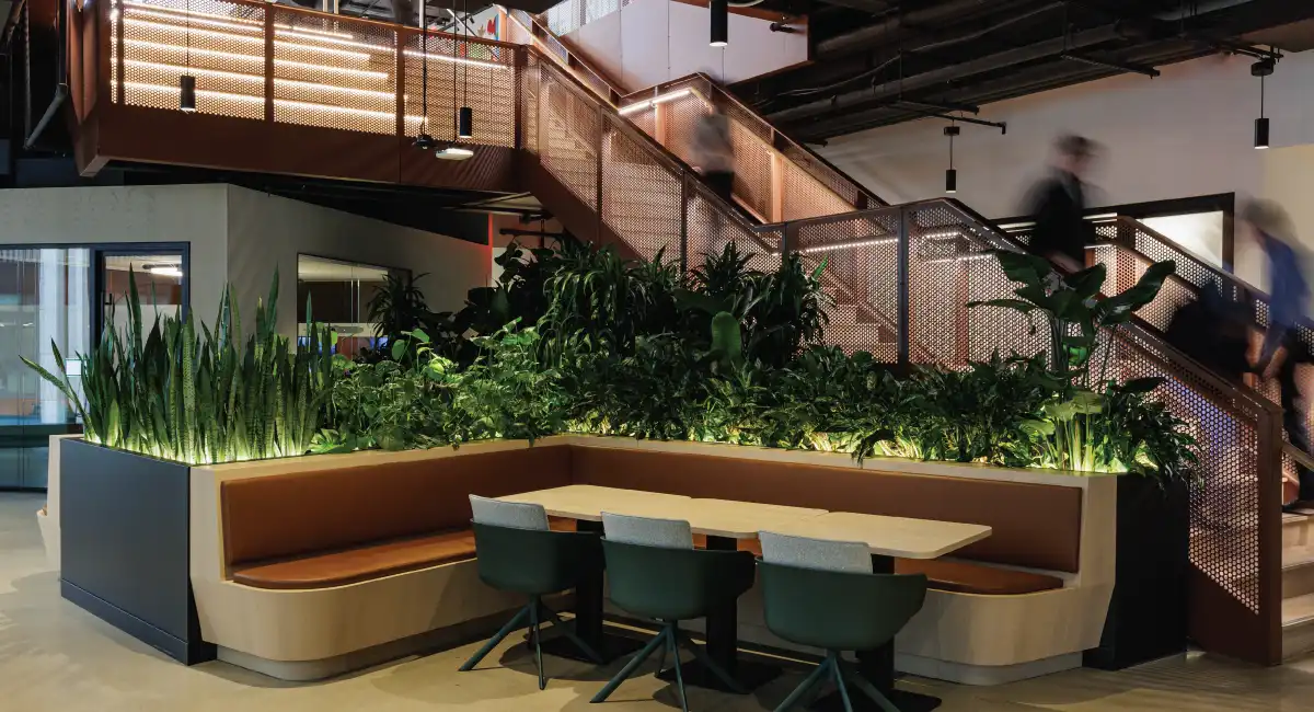 Building lobby with spacious table and chairs and healthy plant box