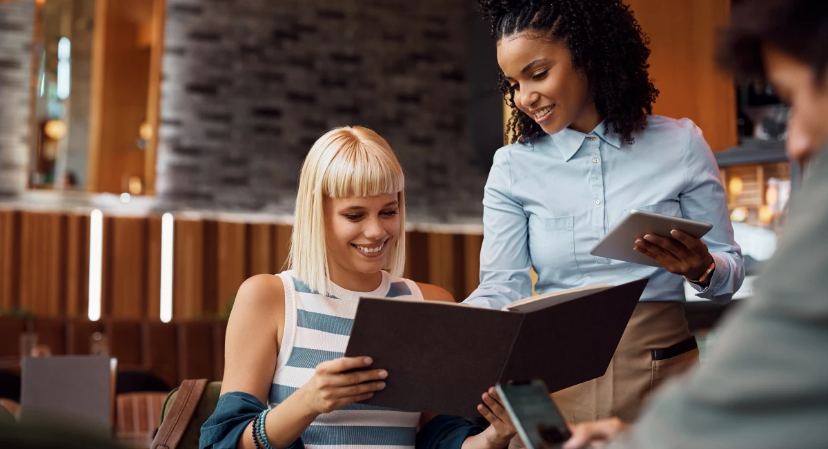 image-banner-stock-happy-black-waitress-recommending-something-from-1411158486.webp