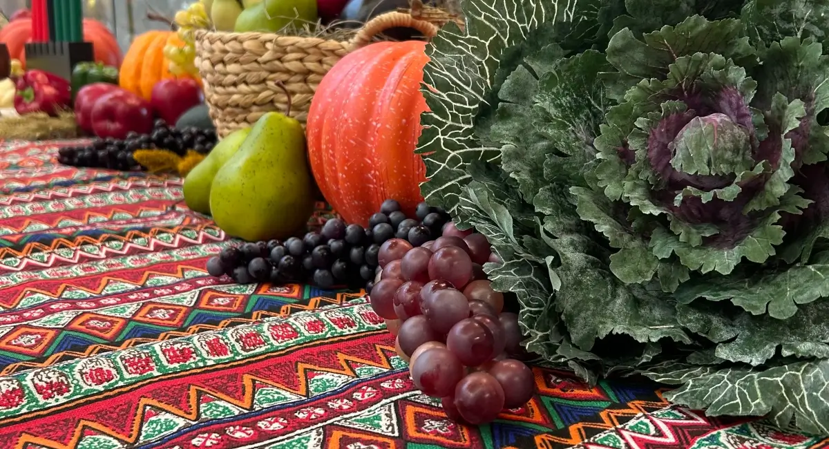 a 12' long banquet table dedicated to the celebration of Kwanza