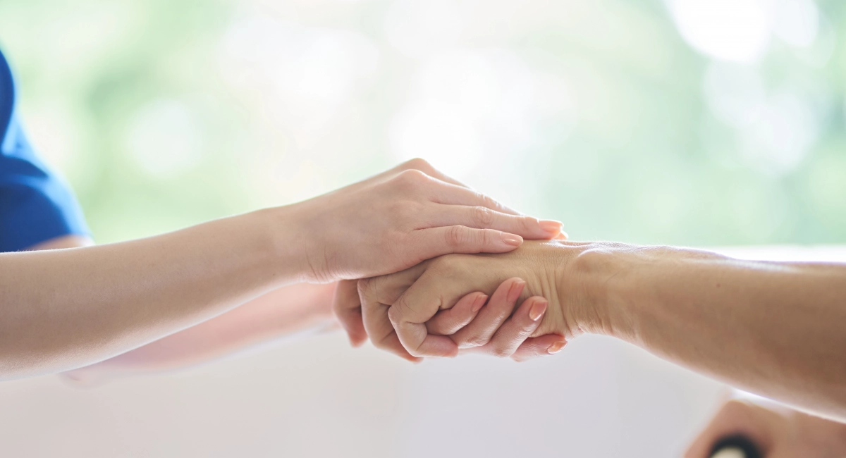 image-banner-stock-hands-of-caregivers-and-the-elderly-1327941293.webp