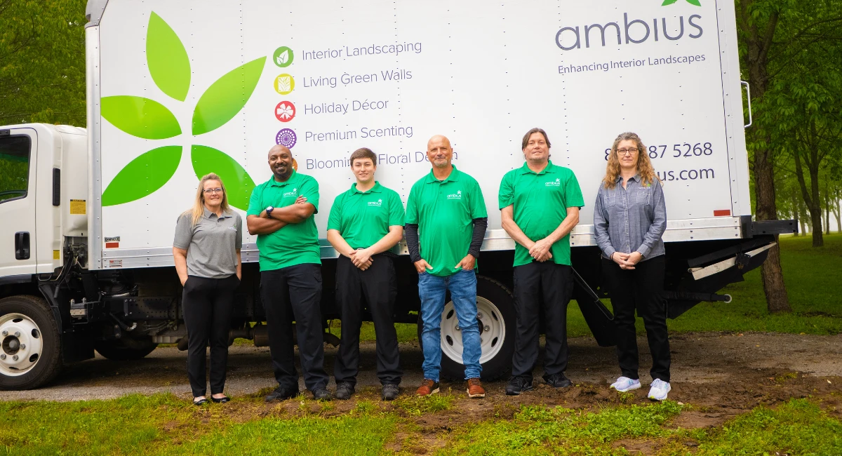 Ambius colleagues with Anne Frank tree transport truck.