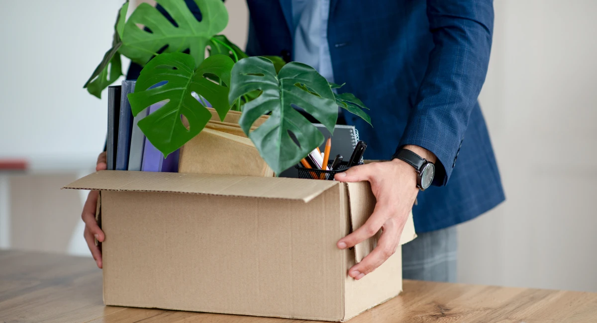 image-banner-stock-young-man-with-box-of-belongings-quitting-job-1350016692.webp