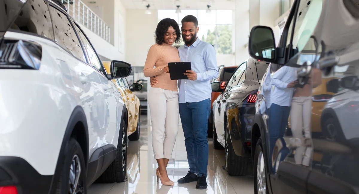 image-banner-stock-young-black-couple-choosing-car-in-modern-1354206947.webp