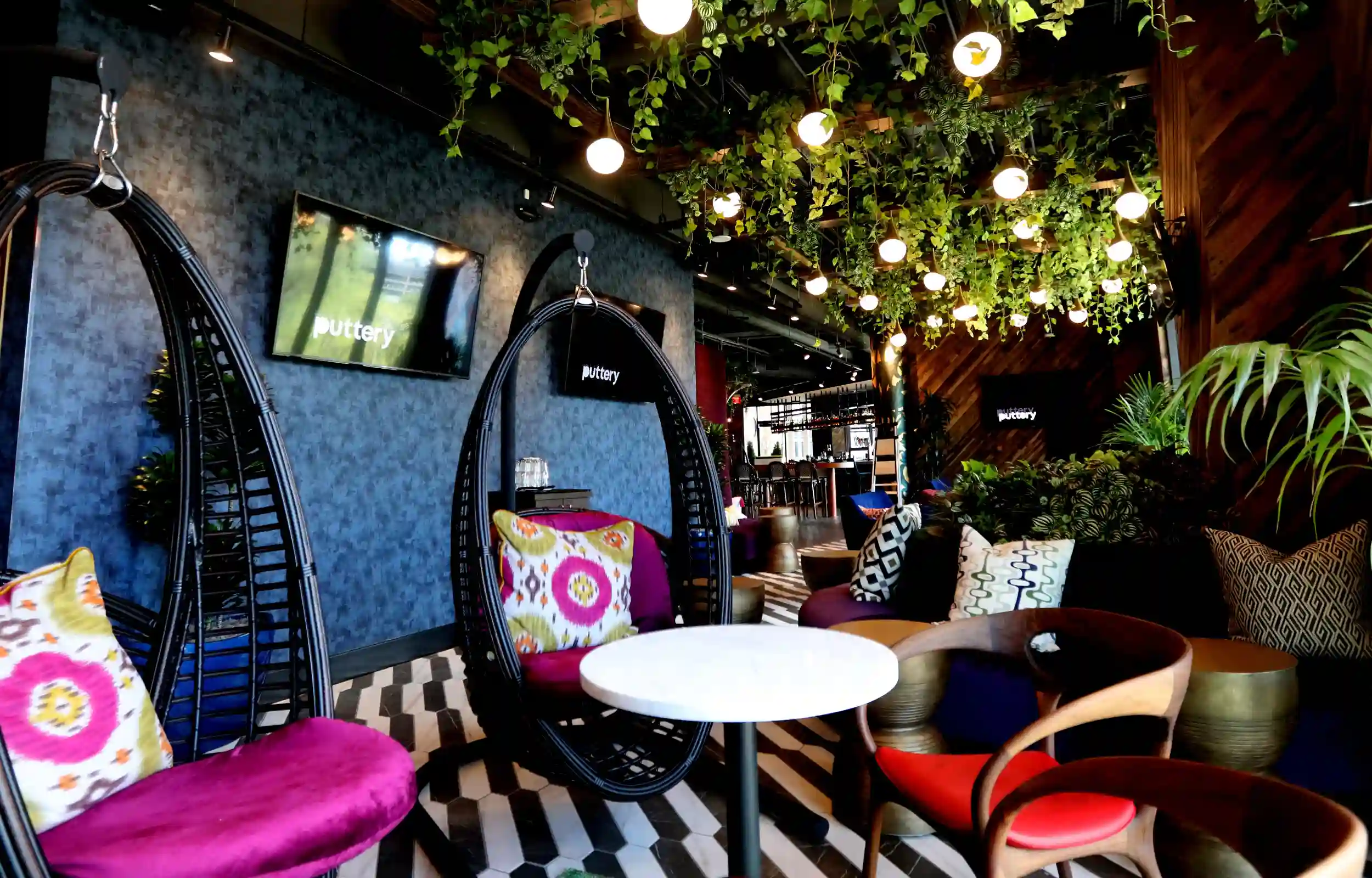 Sitting are with ceiling and potted plants