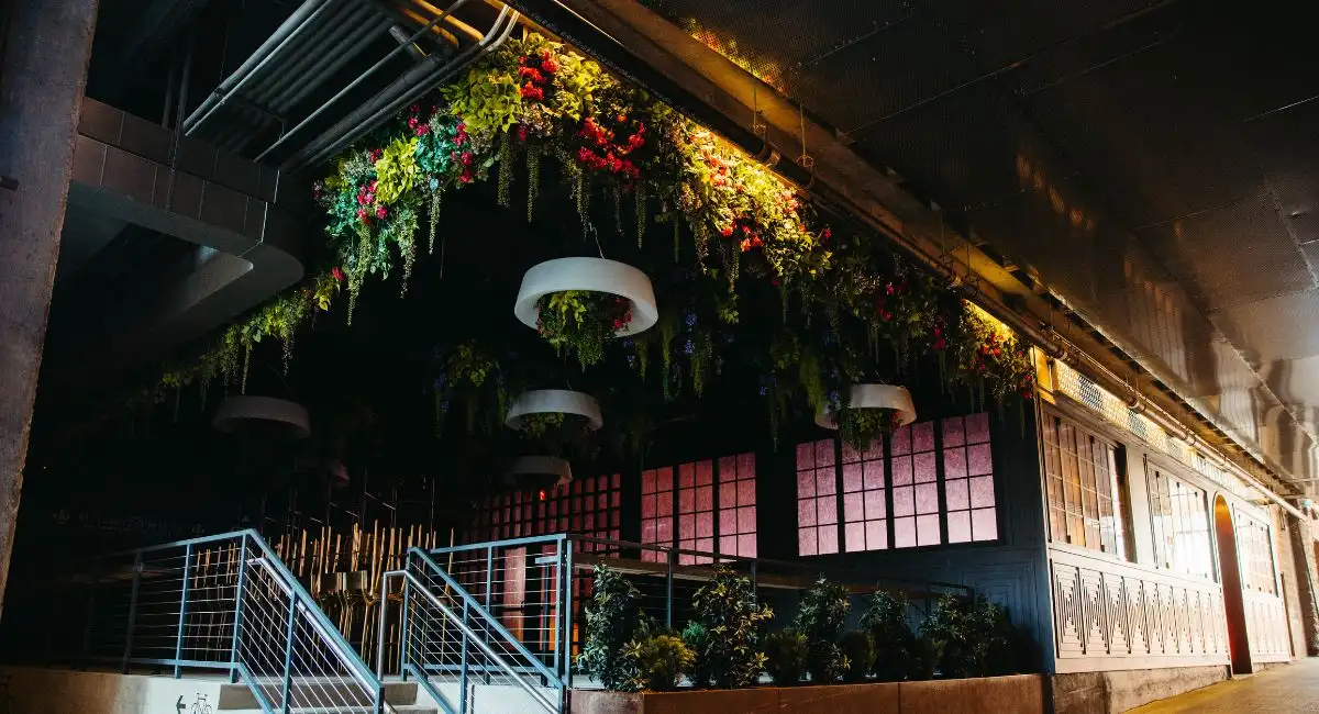 Replica plants on ceiling and lights