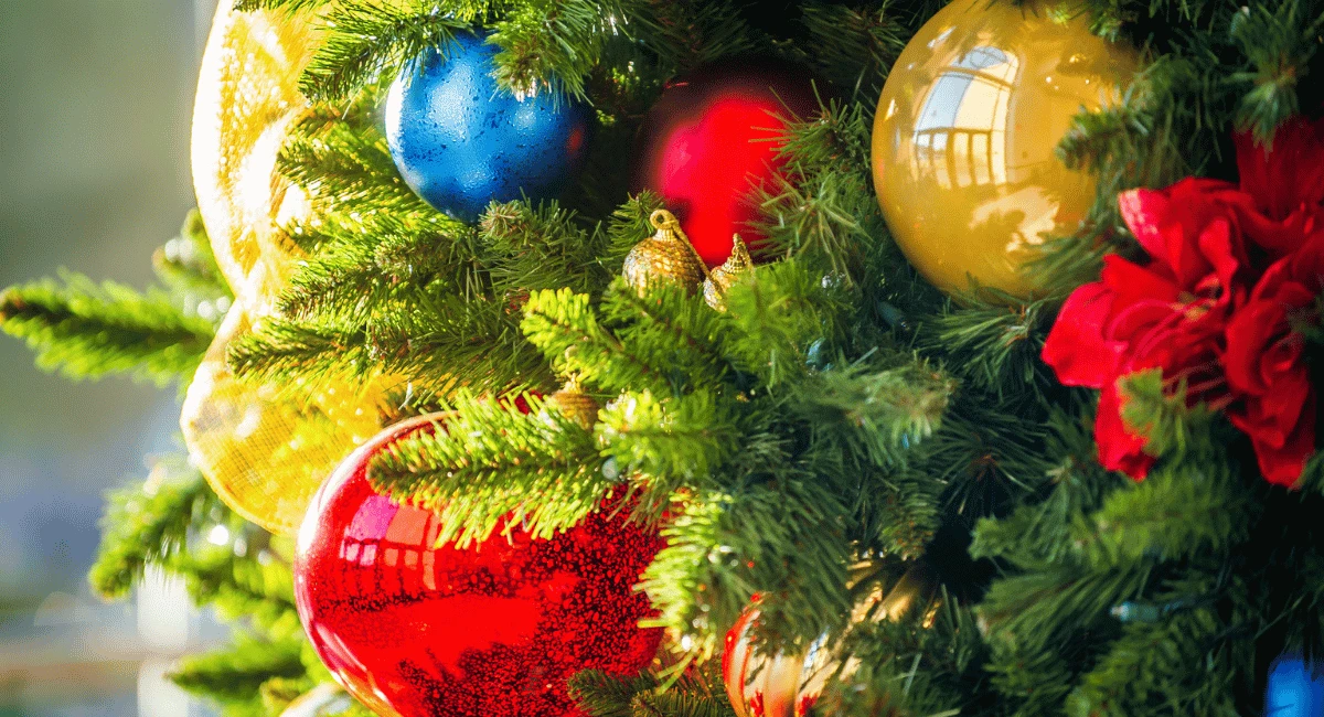 "The More the Merrier" holiday design trend depicted on a Christmas tree.