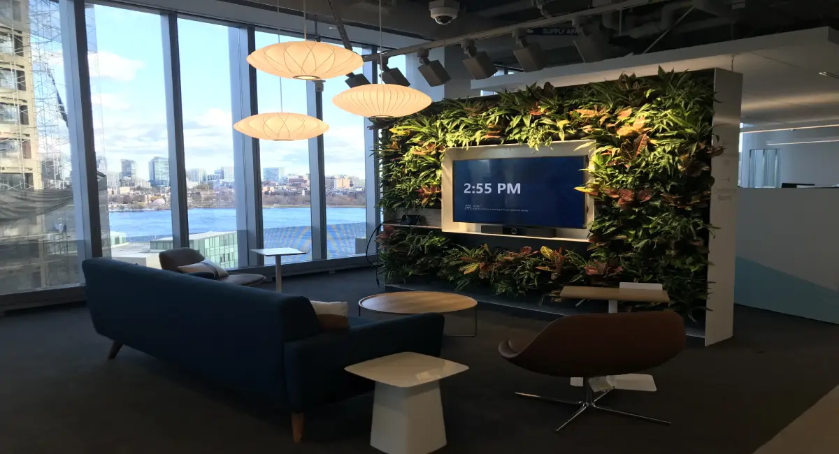 Living green wall around computer monitor in sitting area