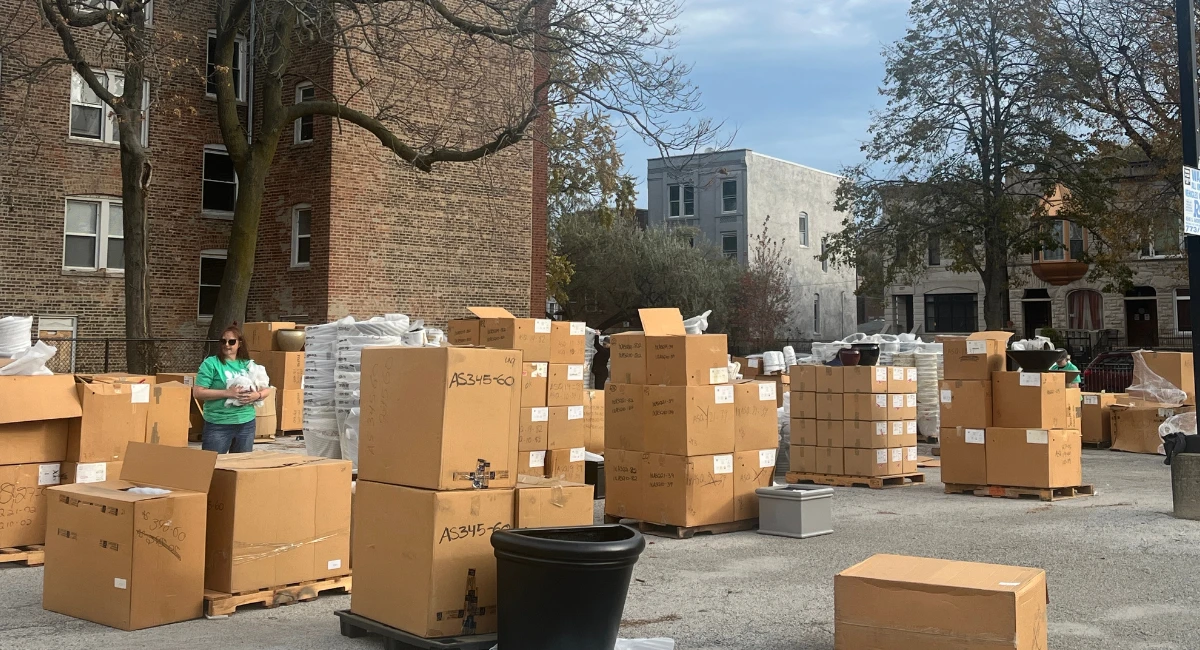 The fully stocked inventory of containers in boxes in a parking lot awaiting pick up by Chicago Public School educators.