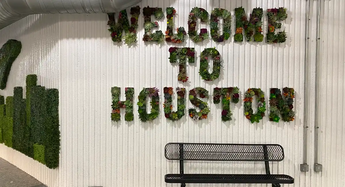 Green wall of welcome to Houston