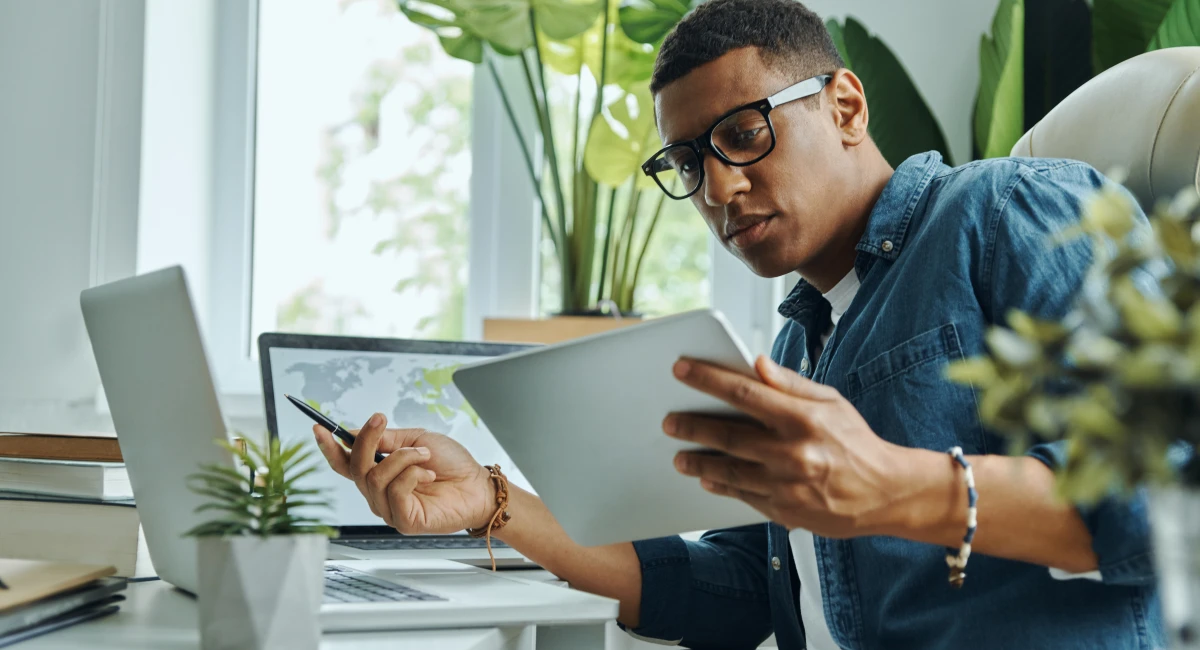 image-banner-stock-busy-young-mixed-race-man-using-technologies-1403839079.webp