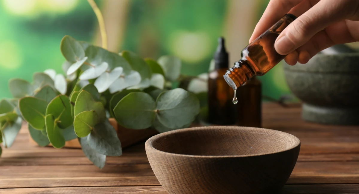 image-banner-stock-woman-pouring-eucalyptus-essential-oil-into-bowl-1350786749.webp